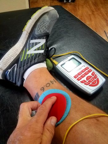 remote rehab apin patient getting the Phoenix Waveform HUNT Method, direct current neurotherapy locating dysfunctional neuromuscular pathways (similar to ARPwave and Neubie Method).
